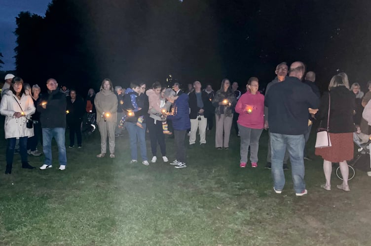 Residents observe the minute’s silence for the Queen at Jubilee Park in Bordon on September 18th 2022.