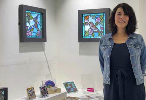 Surrey Artist of the Year 2021 Jessica Stroud with some of her artwork.
