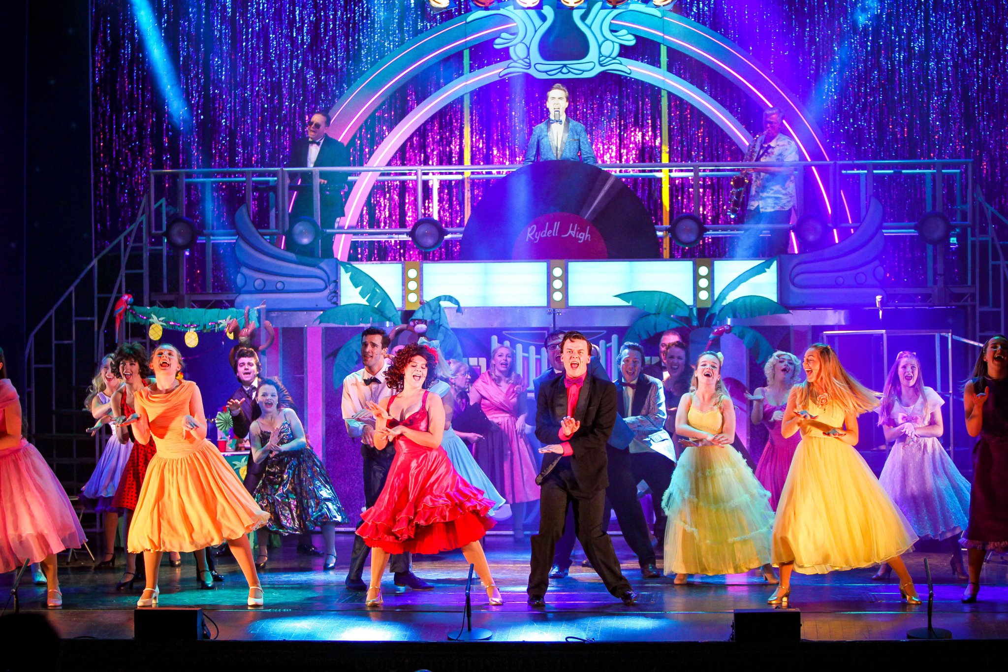 The Grease cast performing Born to Hand Jive