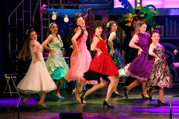 Jordan McCormack as Rizzo with ensemble in Grease