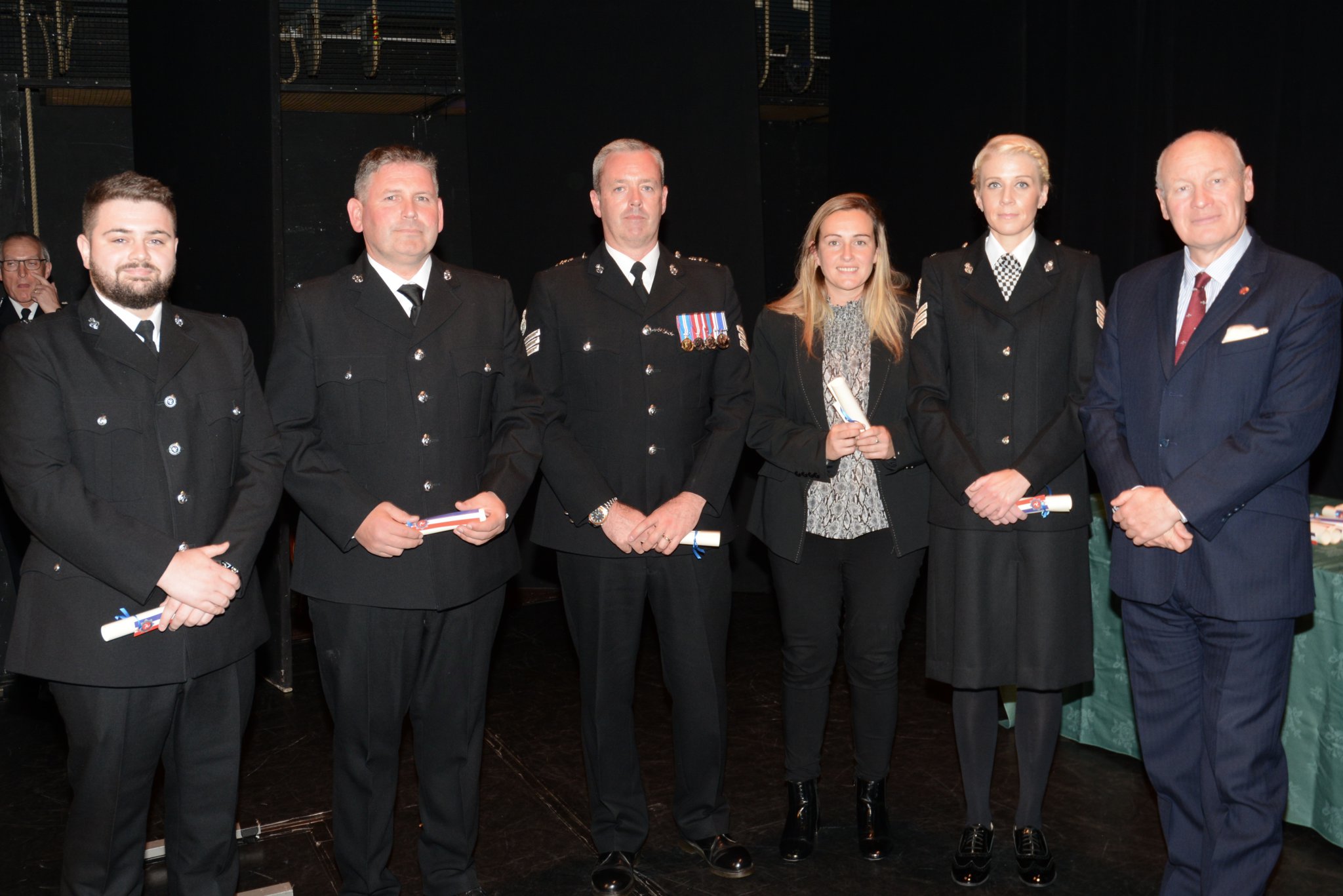 Group of officers receiving commendations from Sir John Lorimer