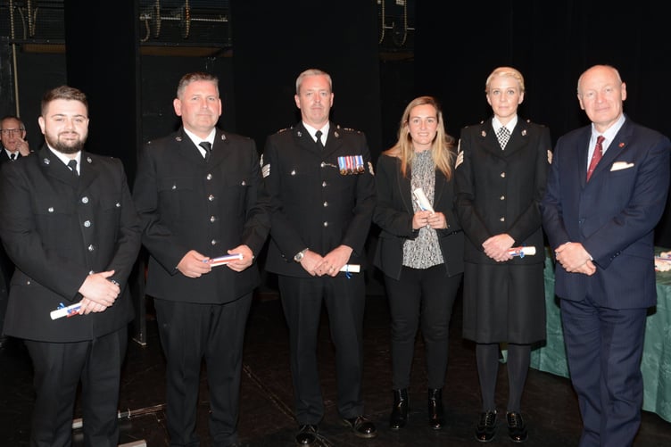 Group of officers receiving commendations from Sir John Lorimer