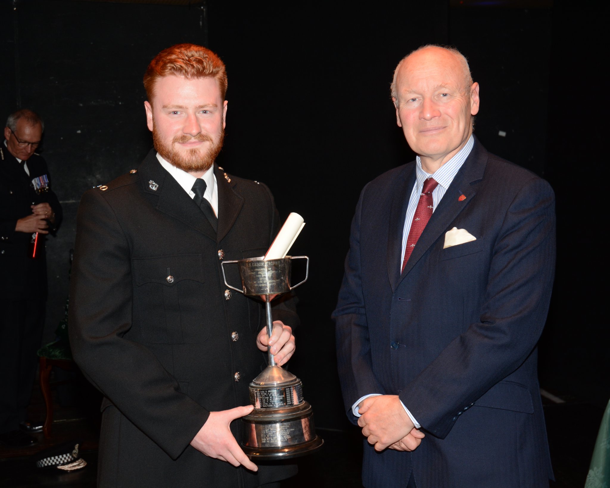 PC Sean Kelly receiving the R.K. Eason Trophy from Lieutenant Governor Sir John Lorimer