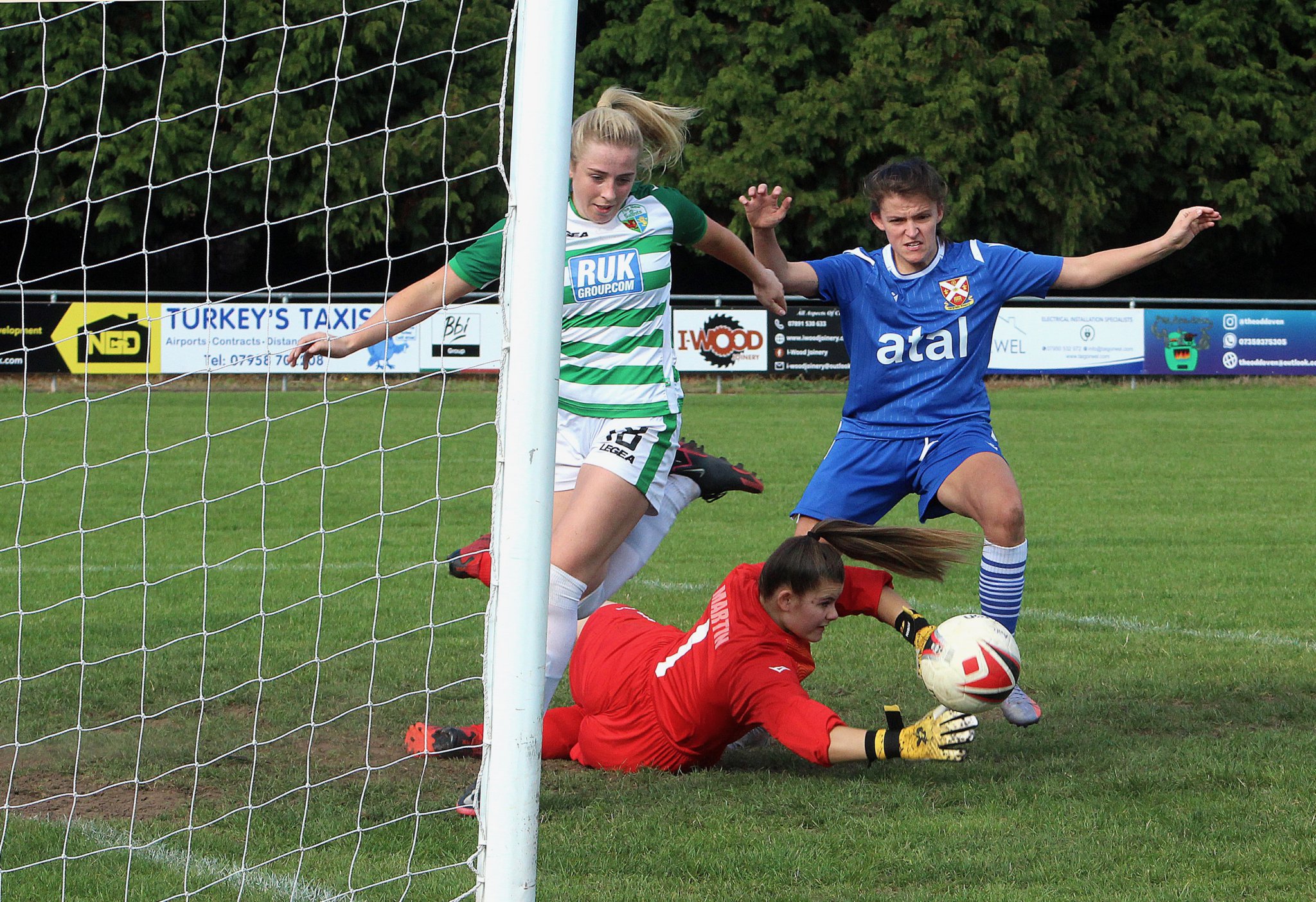 Double goalscorer Ellis Lunn goes close again, left, while Pennies’ captain Ceri Hudson drives forward. Photos: Andrew Kennedy.
