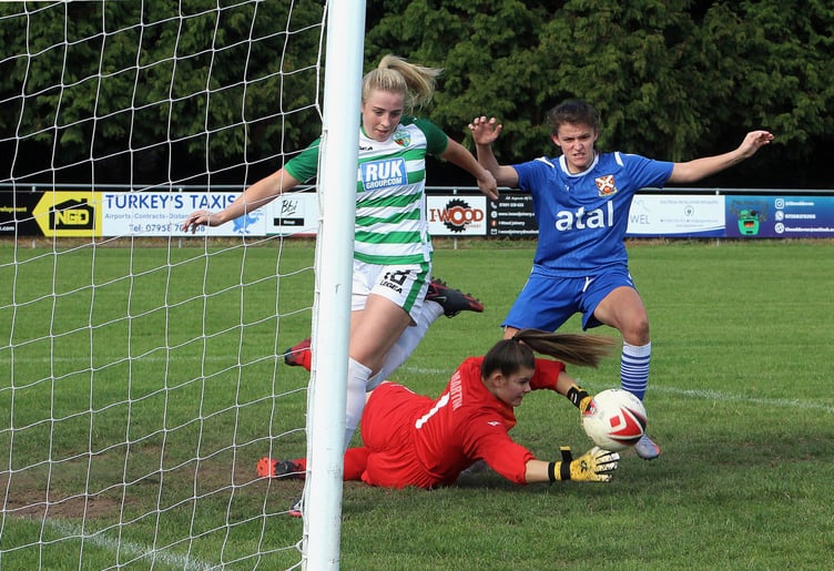 Double goalscorer Ellis Lunn goes close again, left, while Pennies’ captain Ceri Hudson drives forward. Photos: Andrew Kennedy.