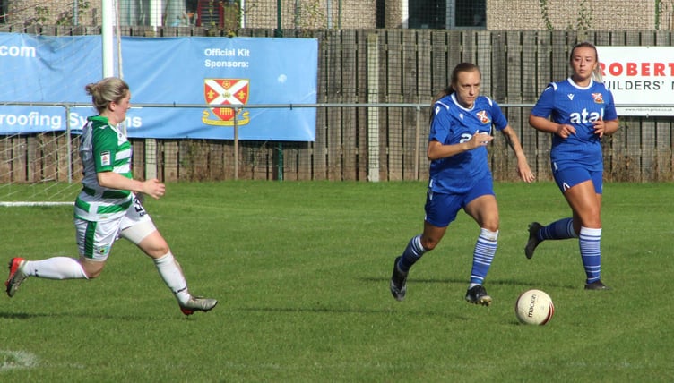 Double goalscorer Ellis Lunn goes close again, left, while Pennies’ captain Ceri Hudson drives forward. Photos: Andrew Kennedy.