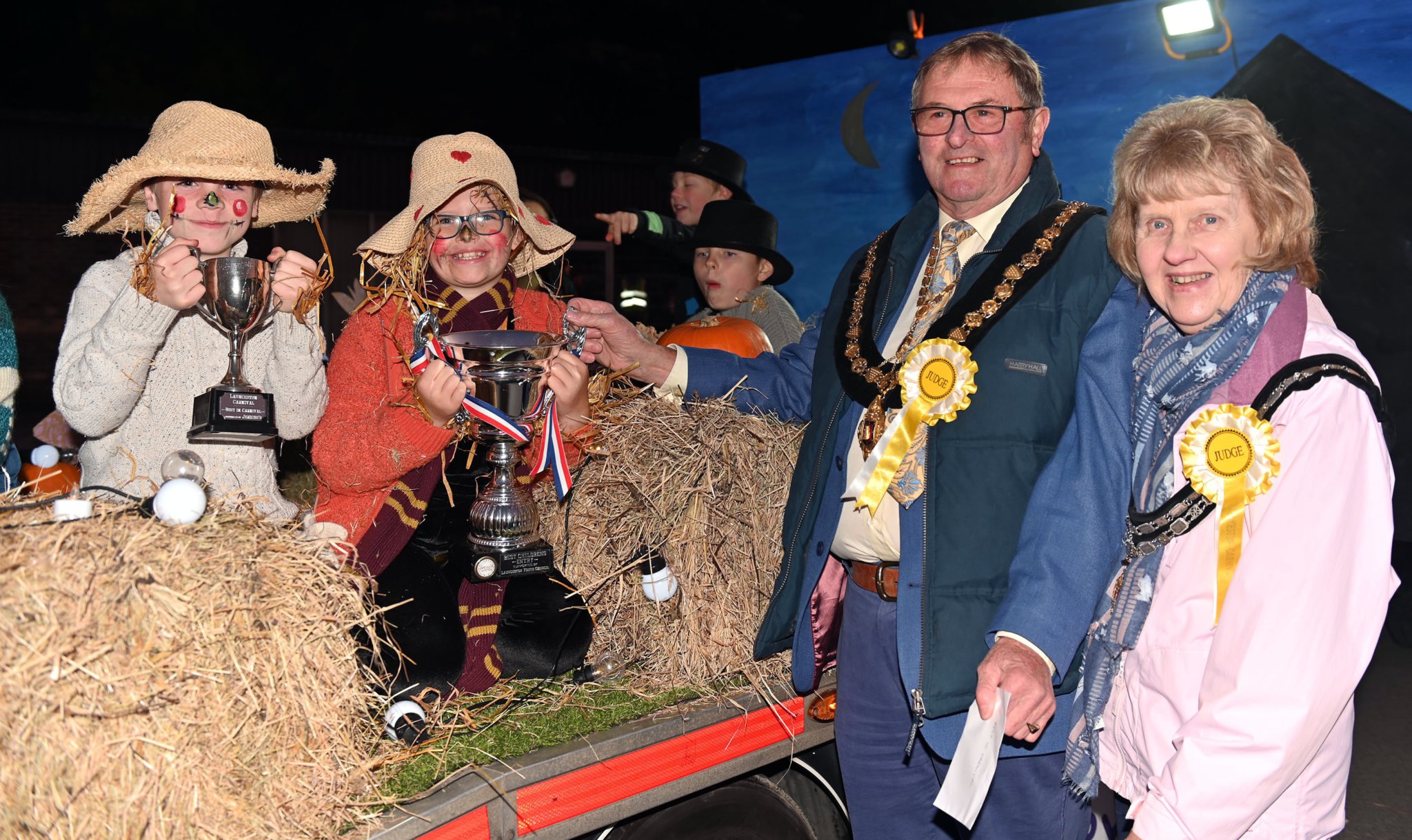 Delighted to recieve the trophy for best overall in the carnival from Launceston Town Mayor Councillor Leighton Penhale and Mayoress Gillian Penhayle are Ali and Leo from Codes Green Primary School