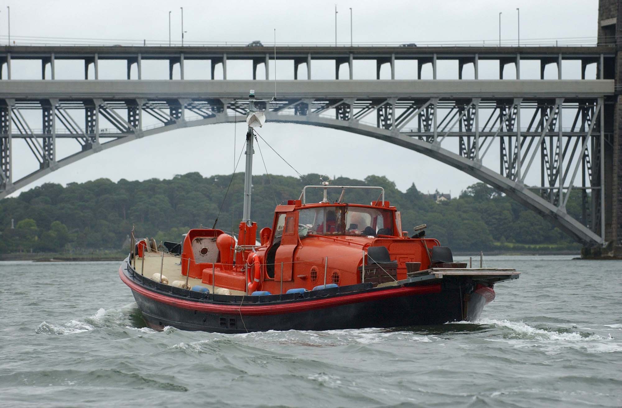 Southport Girl sails under the Britannia bridge, Menai Strait, North Wales. Photo: Richard Williams