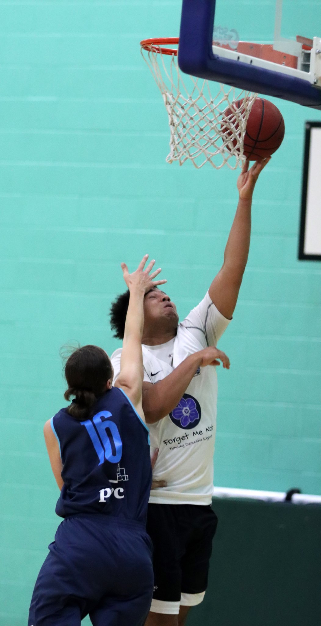 Forget Me Not Jets’ Peter Boussougou goes for the lay-up against the defence of PwC Hoops’ Oksana Fedorovych during the two sides’ Senior League clash at the NSC on Thursday evening. Jets won the match 86-22