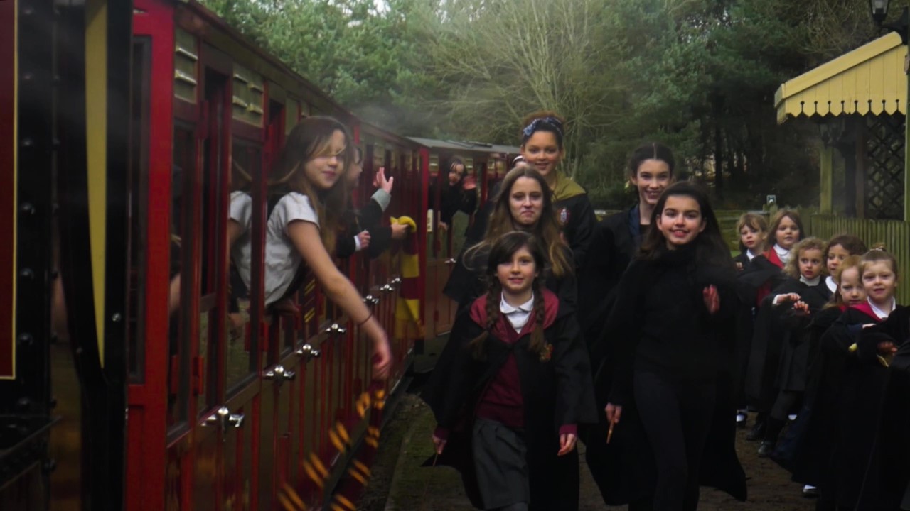 The dancers in action with their own ‘Hogwarts Express’ at Coleford’s Perrygrove Railway
