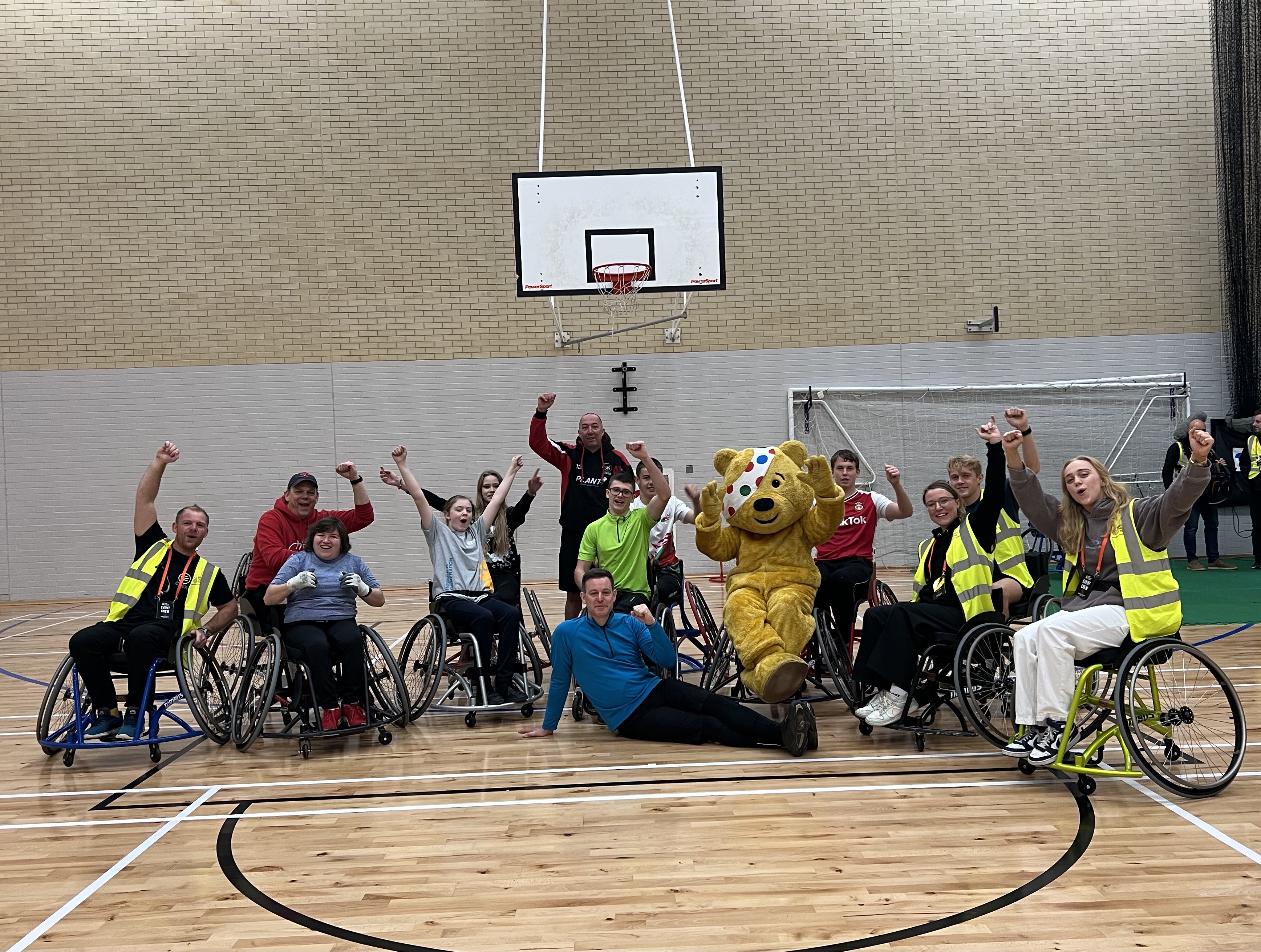 Kai and the Wheelchair basketball team with Pudsey the Bear