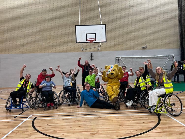 Kai and the Wheelchair basketball team with Pudsey the Bear