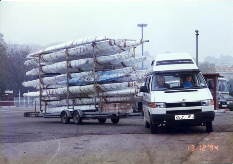 David driving with a large number of kayaks on a trailer in years gone by.