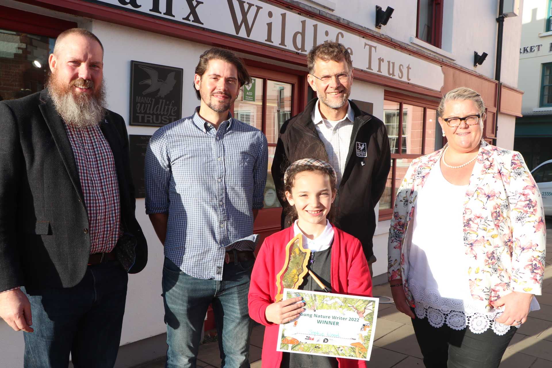 Sophie Wood, eight, winner of Young Nature Writer 2022, with, from left, Graham Makepeace-Warne, engagement manager of Manx Wildlife Trust, Rob Fisher of the Manx Ornithological Society, Leigh Morris, chief executive of the Manx Wildlife Trust, Clare Barber MHK, vice-cChair of UNESCO Biosphere Isle of Man