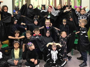 <p>School pupils at St Matthew’s School, Blackmoor, dressed as bats for teacher Miss Soal’s spooky Hallowe’en-themed wedding day</p>