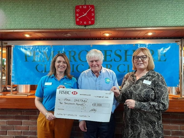 Club Chairman Mike Chilton presenting a cheque for £2000 to Toni Dorkings and Janet Bevans, representing the Paul Sartori Hospice at Home Foundation.