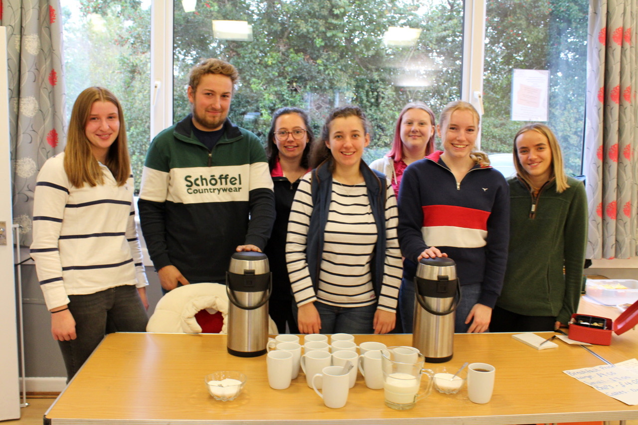 Members of Bow YFC with their chairman, Jess Burrows, secretaries, Georgia Hill (second from right) and Declan Arnold (second from left) with members on the coffee and tea table. SR 6292