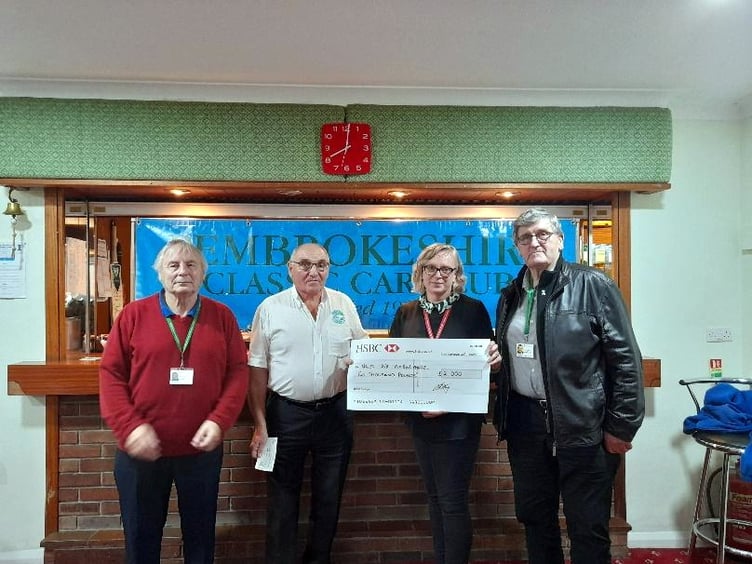 Club Secretary Peter Badham presenting a cheque for £2,000 to Hannah Bartlett , Rhys Watkins and Noel Evans representing Wales Air Ambulance