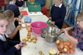 School children’s soup kitchen feeds village