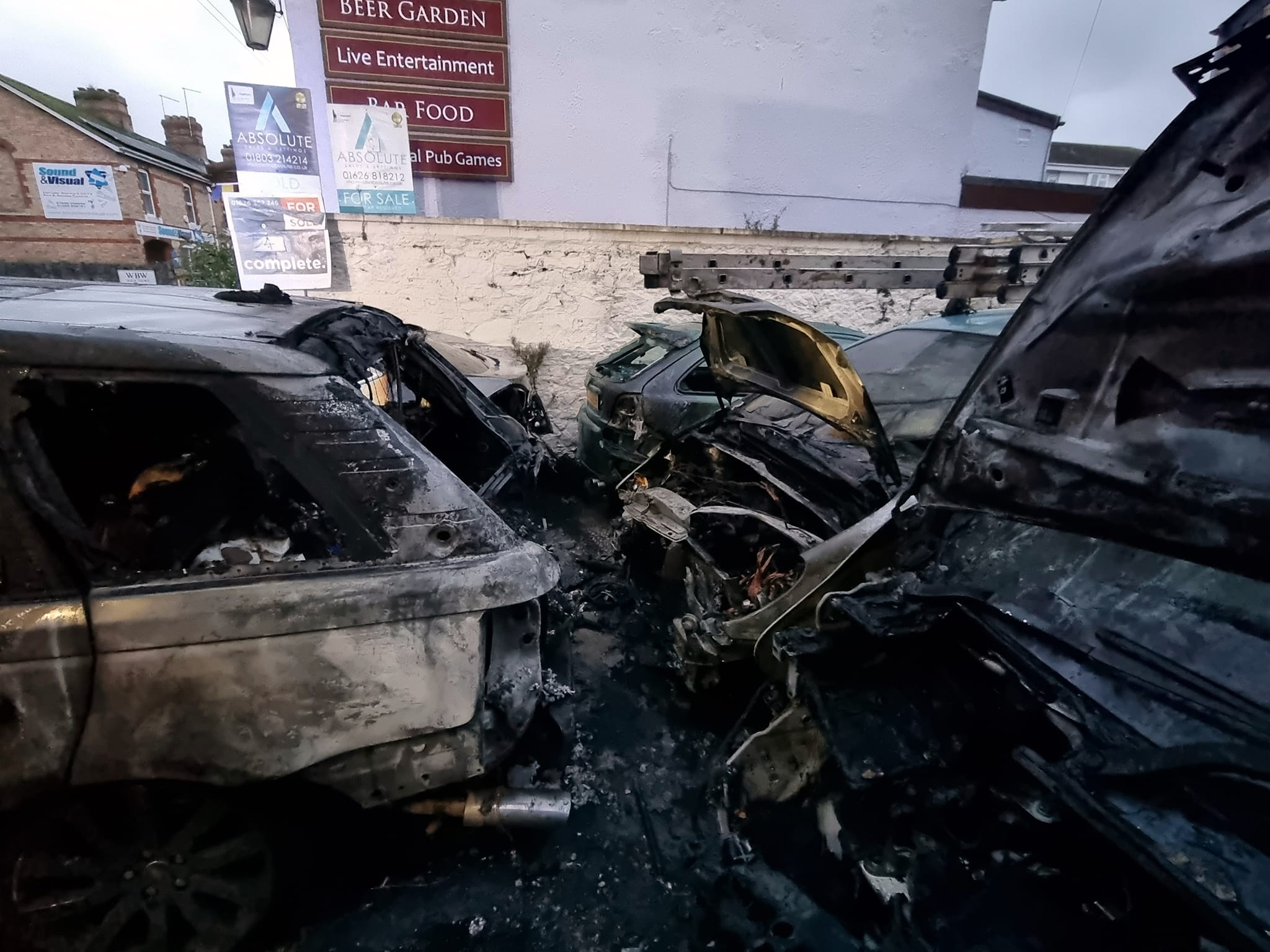 FIVE cars were burning when Newton Abbot Firefighters reached this site just off Queen Street. Picture: Newton Abbot Fire Station