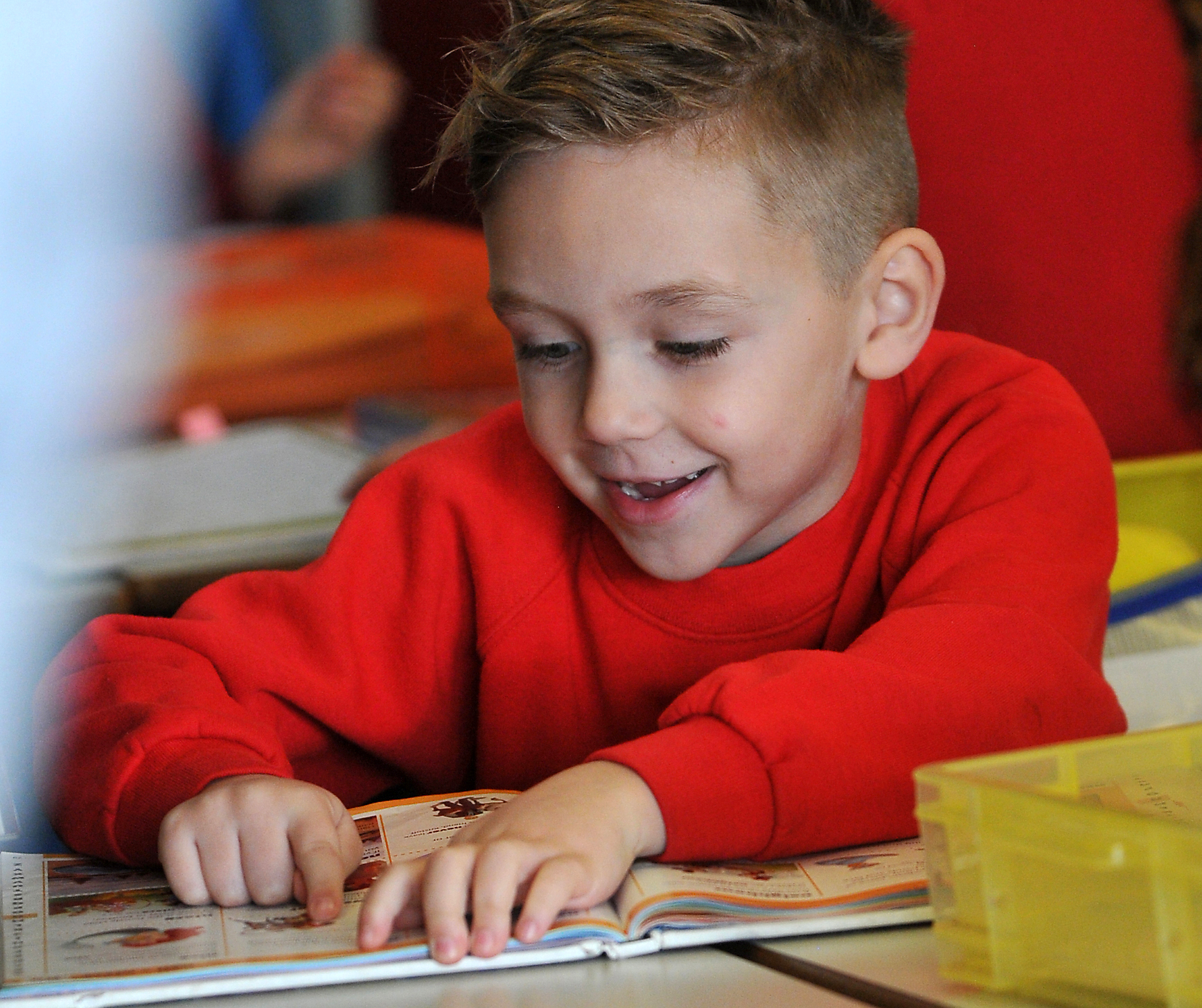 Photo: Steve Pope MDA161122A_SP004
Book Buzz at Hazeldown Primary School in Teignmouth. Engrossed in a good book - KS1 pupil Hunter