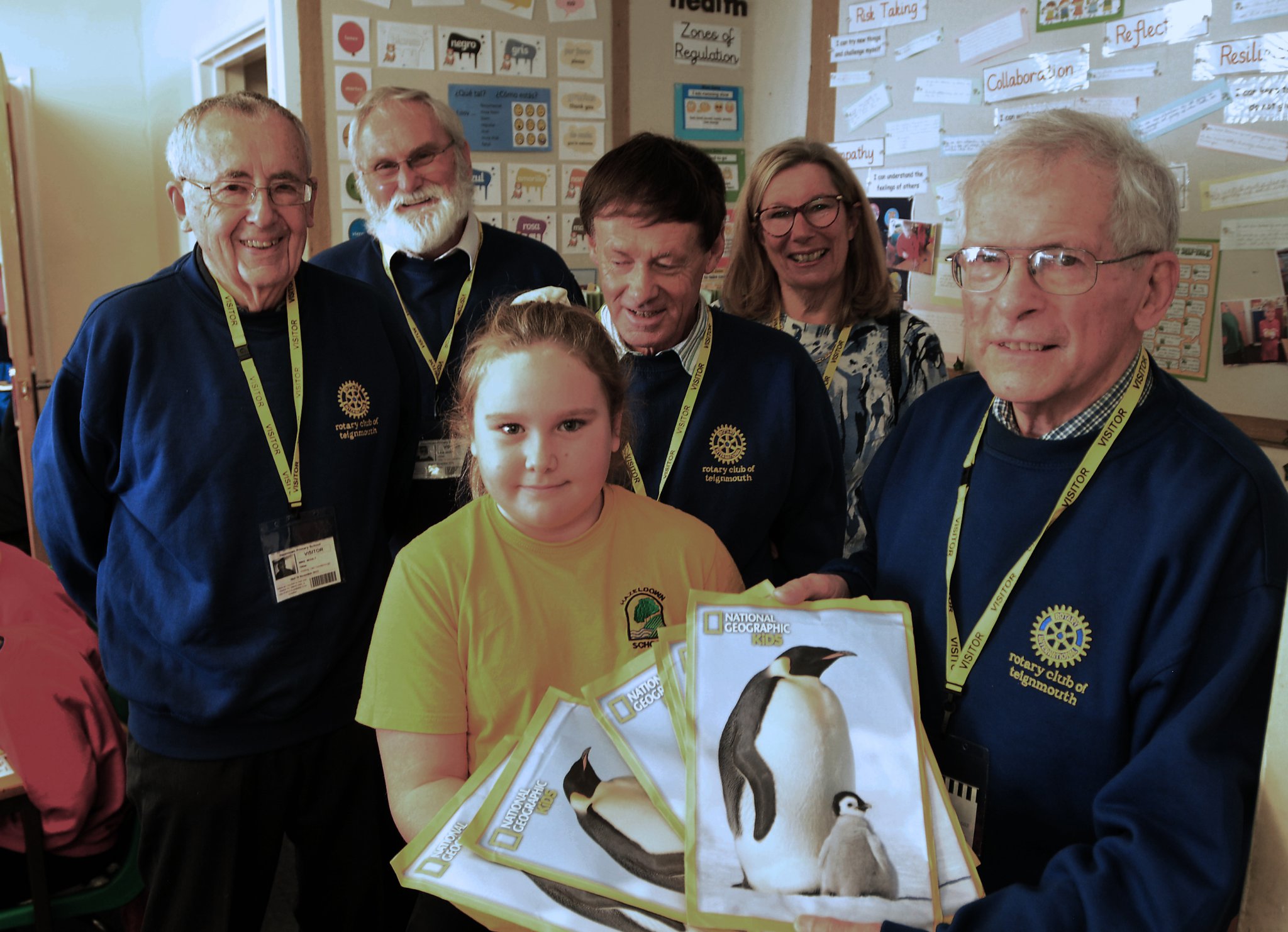 Photo: Steve Pope MDA161122A_SP011
Book Buzz at Hazeldown Primary School in Teignmouth. Year 4 pupil Grace receives the National Geographic for Kids subscritption on behalf of the school from members of the Rotary Club of Teignmouth