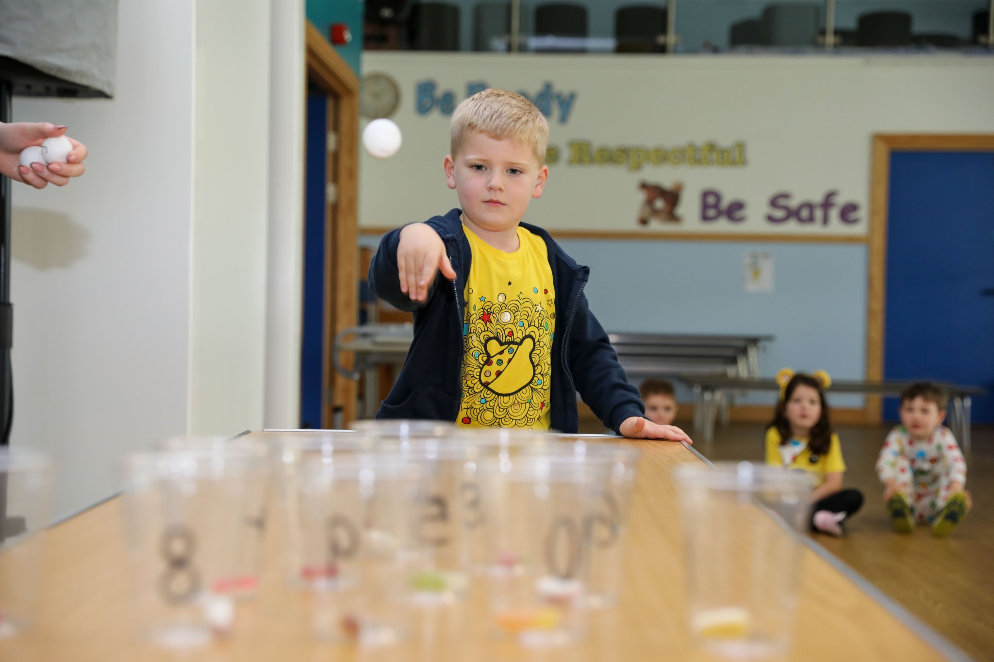 Cooper Birch playing Bear Pong at Henry Bloom Noble Primary School for Children in Need. Photo by Callum Staley (CJS Photography)