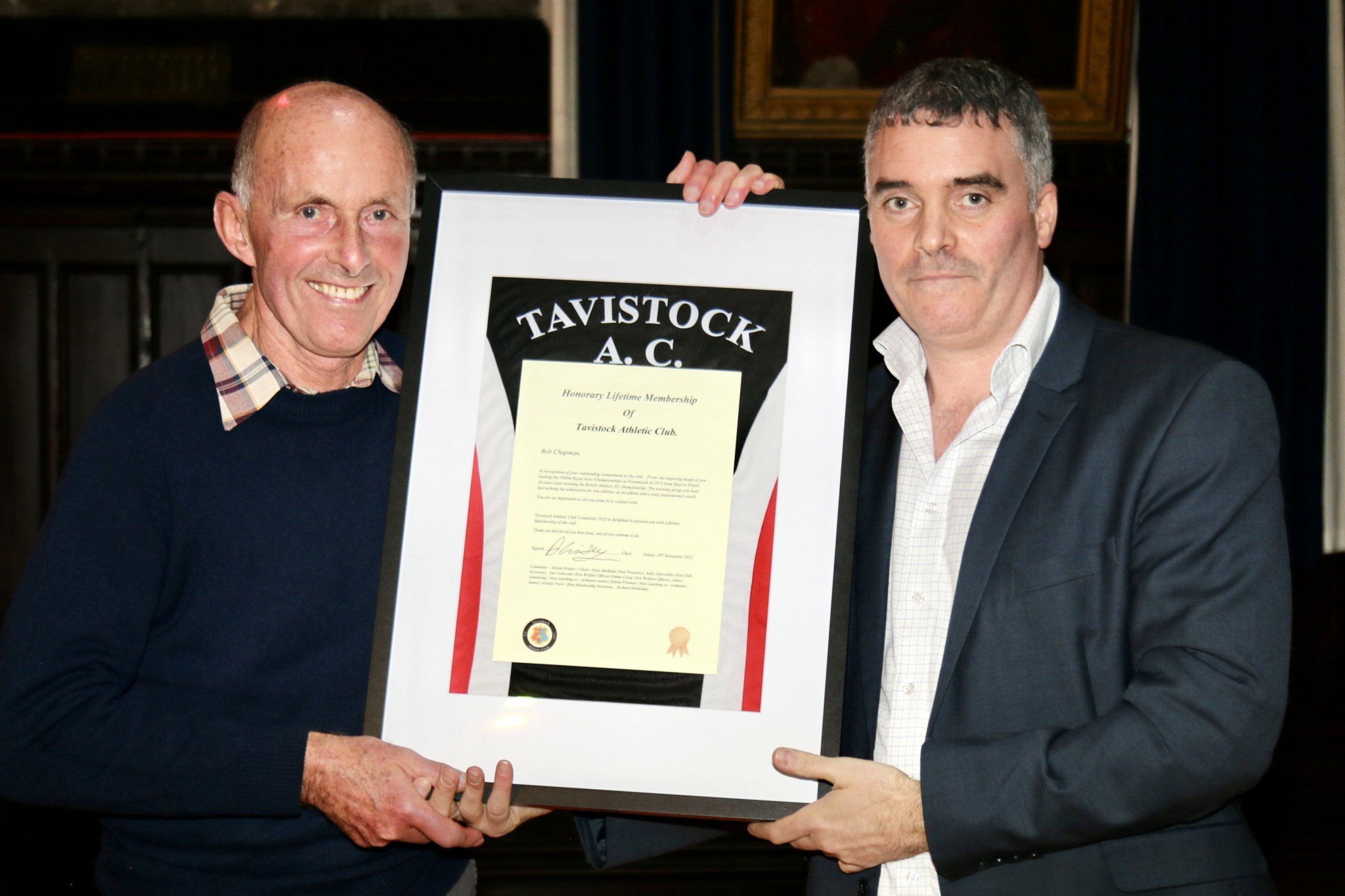 ABOVE: Bob Chapman receives a framed Tavistock Athletic Club vest to mark his honorary lifetime membership of the club. BELOW: Young athletes show their silverware from a successful club awards night.