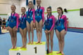 Gymnasts turn on class to land titles and medals