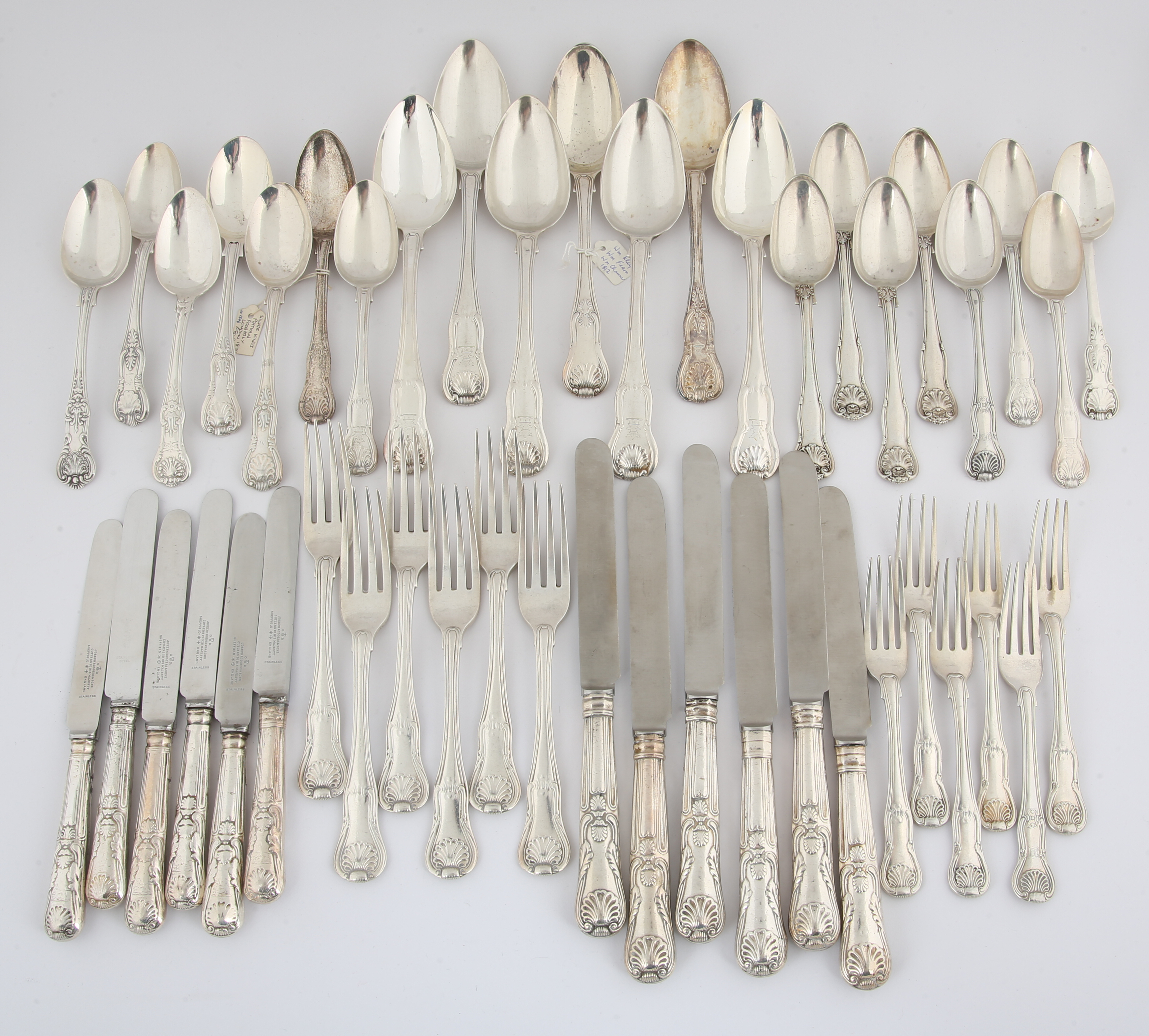 A composite collection of Kings pattern silver flatware, George III and later, comprising, six tablespoons, six table forks, six dessert forks, 15 dessert spoons, 12 knives in two sizes, weight excluding knives, 78.6oz (2447 grams) in a box. The estimate is £700-800