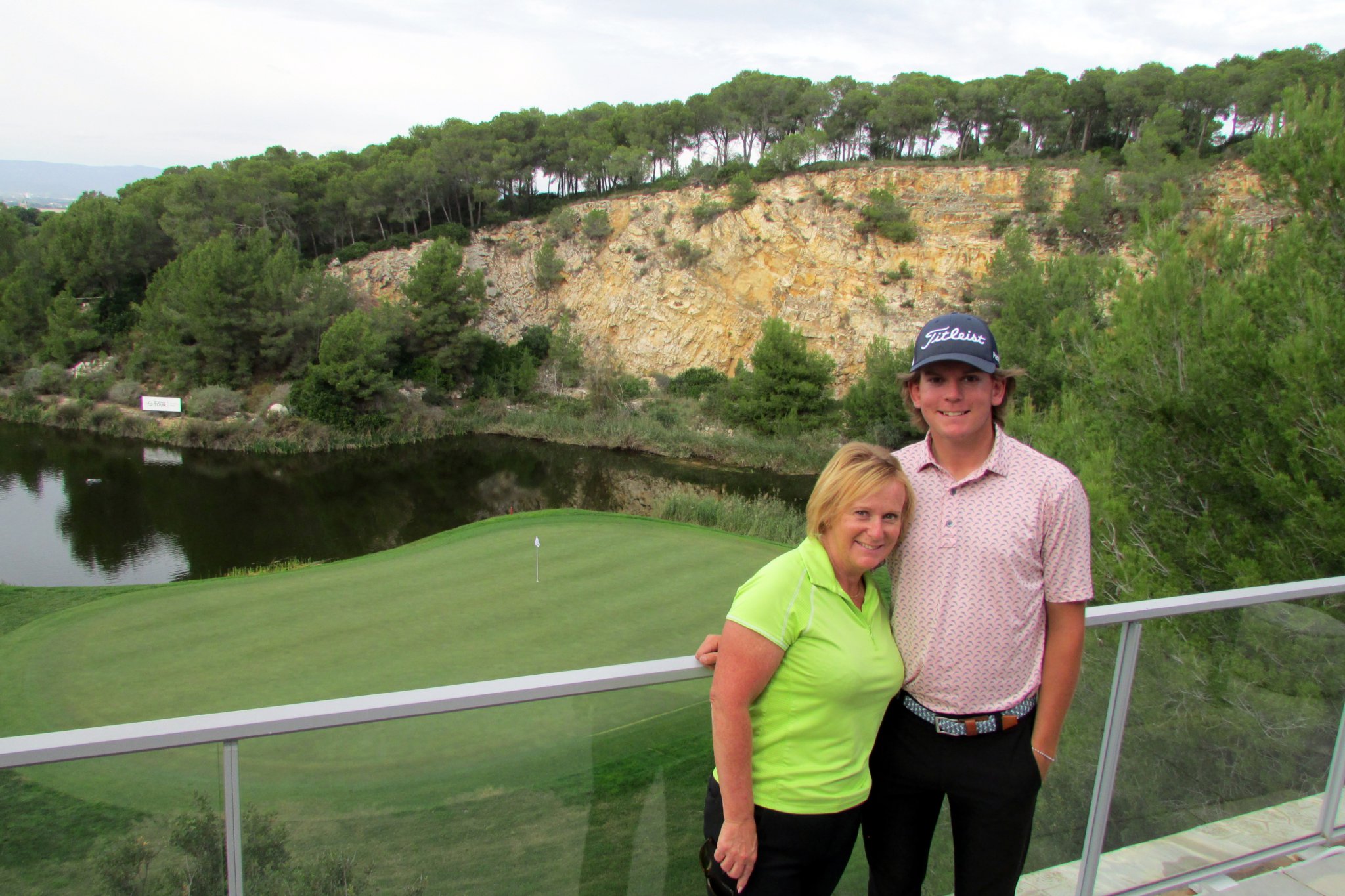 Luke with his mother and caddie above the 18th green on the Hills Course.
