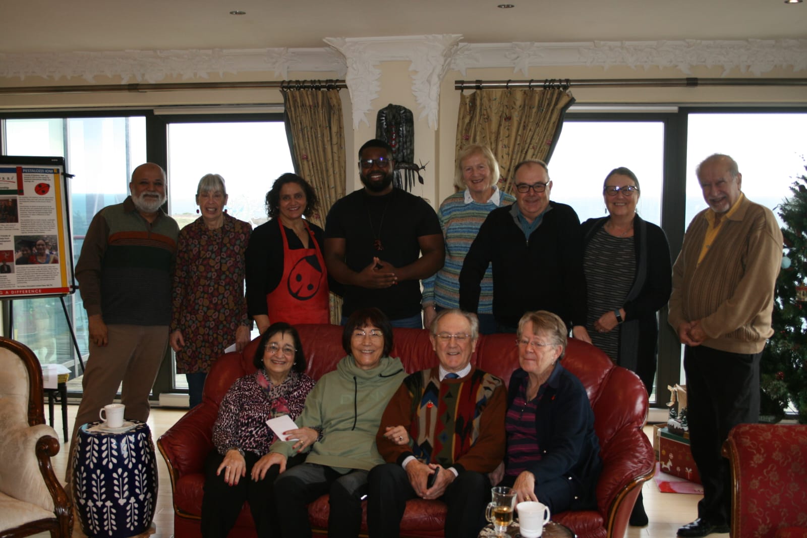 Washington Mudziviri with a group whilst visiting the Isle of Man in 2022