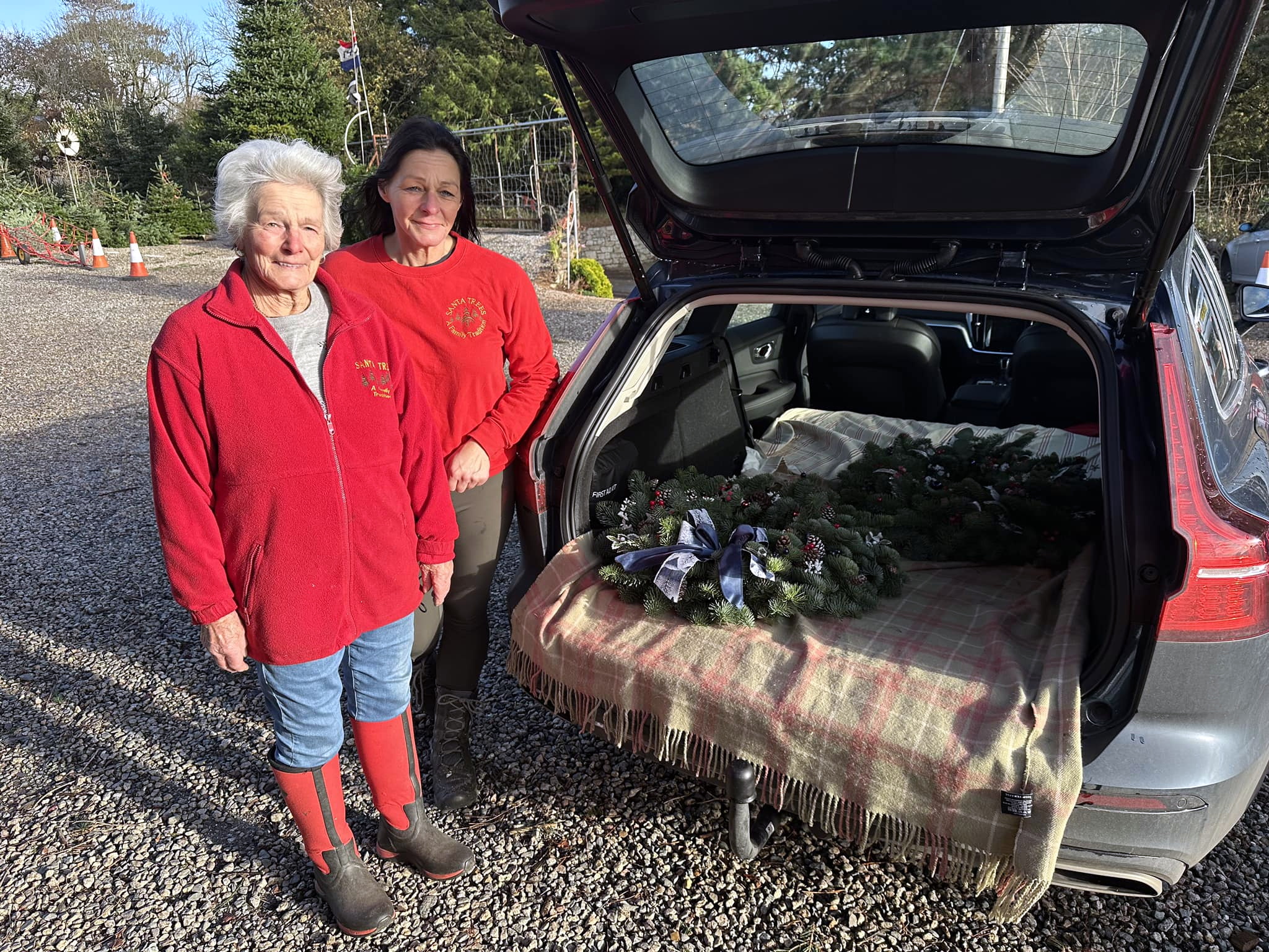 ABOVE: Helen and Margaret from Santa Tree’s with their Downing street wreath; Below, The Wreaths on their way to London
