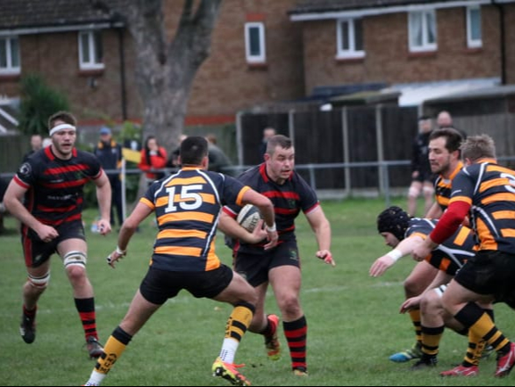 Ed Pasfield carries the ball forward for Alton