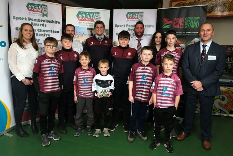 Club of the Year winners Cresselly Cricket Club with Simon Roach of Strength Academy Wales.