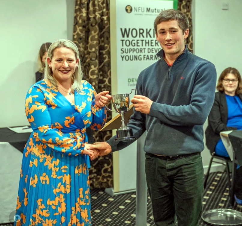Last years Bradworthy Chairman, Tom Nancekivell, collecting the Broadlands Cup from outgoing Devon County Chairman Rosie Bennett