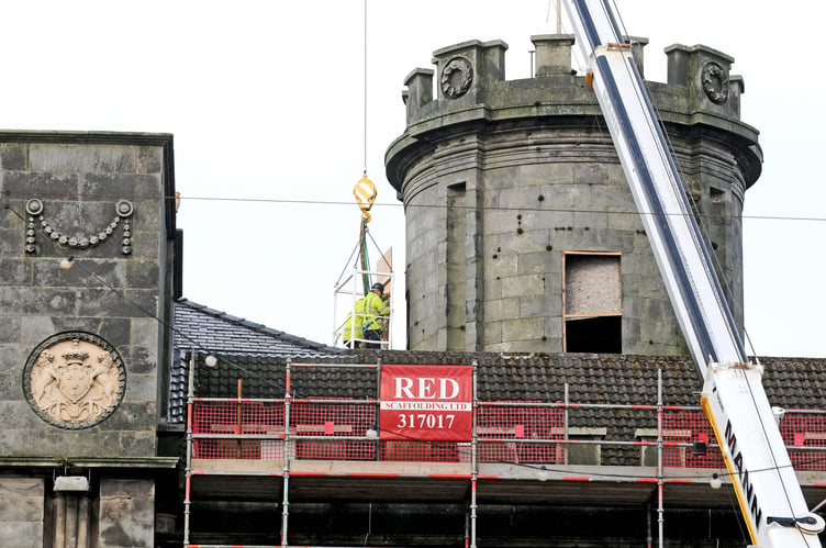 Work at the former Castle Mona Hotel to cover the windows around the central tower -