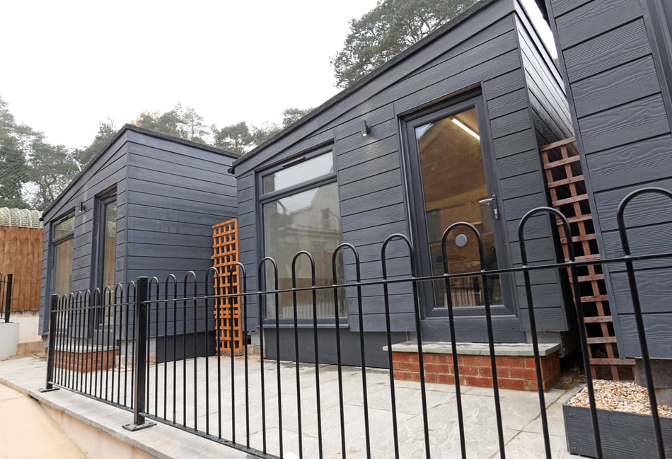 <p>There are three bigger accommodation pods outside Pinewood village hall </p>