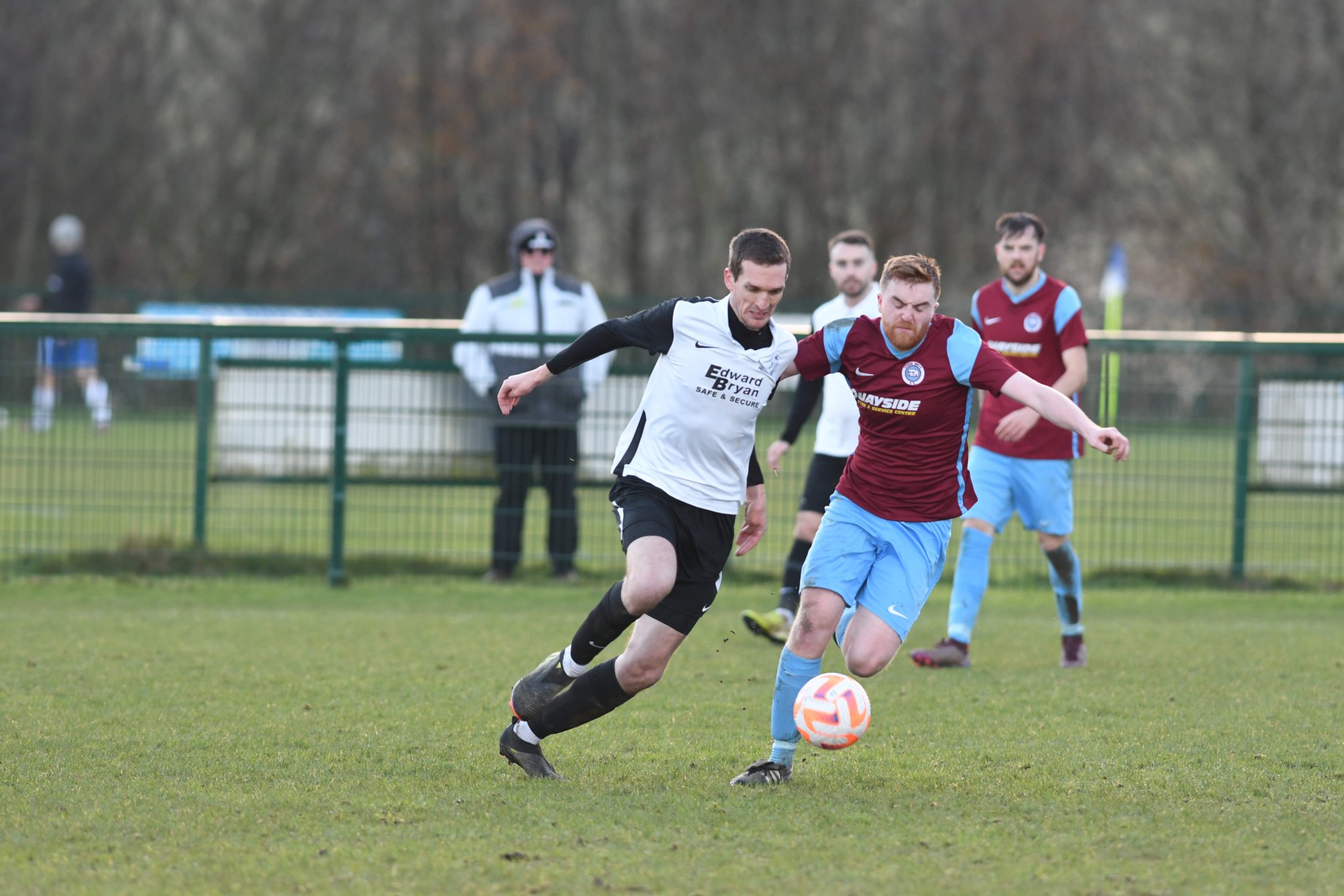 Corinthians striker Jay Chatwood (left) looks for a way past Union Mills defender Owen Quayle during Saturday’s Canada Life Premier League clash at Ballafletcher. Chatwood scored a hat-trick to help the Whites win 5-3 (Dave Kneale DK221210(196))