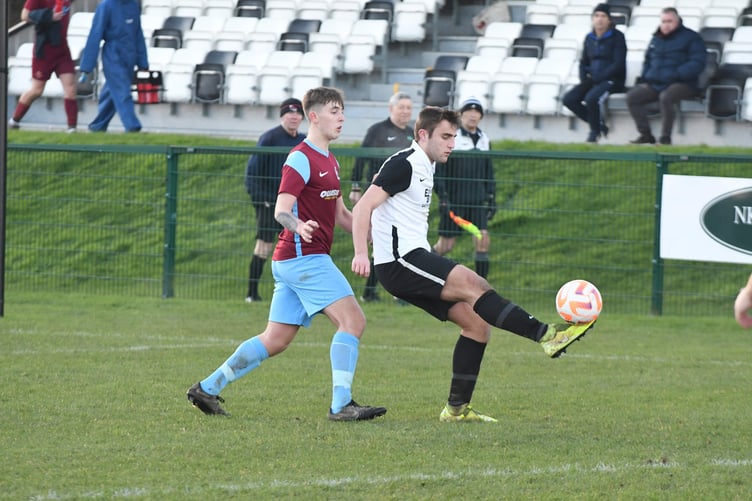 Corinthians’ Joe Middleton controls the ball as he attempts to hold off a Union Mills opponent during the weekend’s top-four clash at Ballafletcher (Dave Kneale DK221210(187))