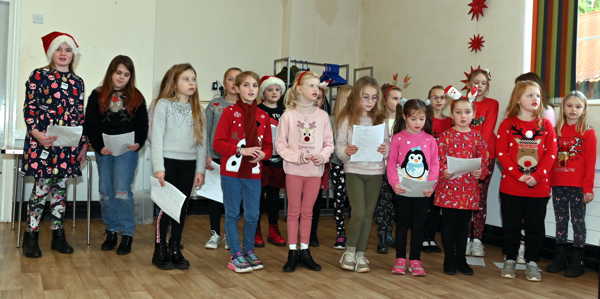 ABOVE: Best friends Stephanie Jasper and Di Pengelly; Left, In fine voice giving their rendition of some Christmas favourites are members of the Camelford Primary School Choir. Pictures: Adrian Jasper