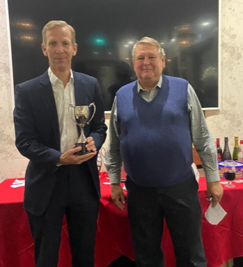 Chairman Keith Ellis awarding Mike Hughes with the performance of the year trophy