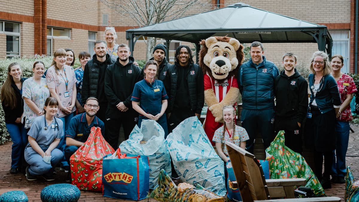 Exeter City FC players bring cheer to children in hospital ...