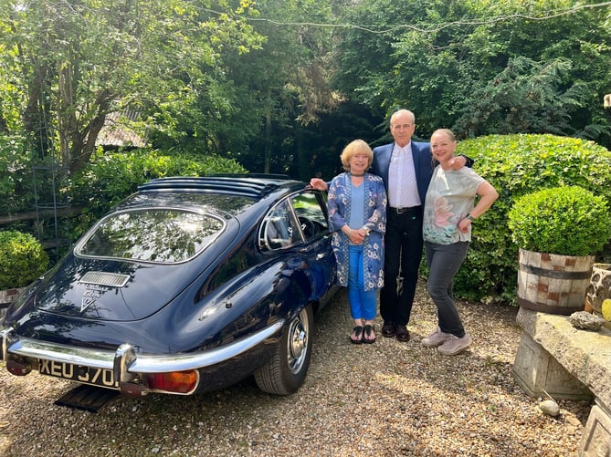 Francis Rossi and his E-Type Jag flanked by Antiques Warehouse owners Hilary (left) and Rachel Burroughs