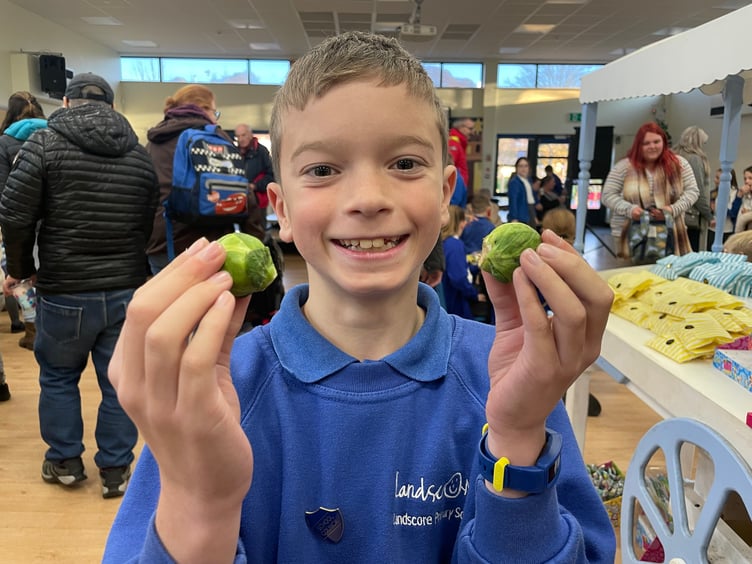 A youngster who won two Brussels sprouts on the lucky dip.