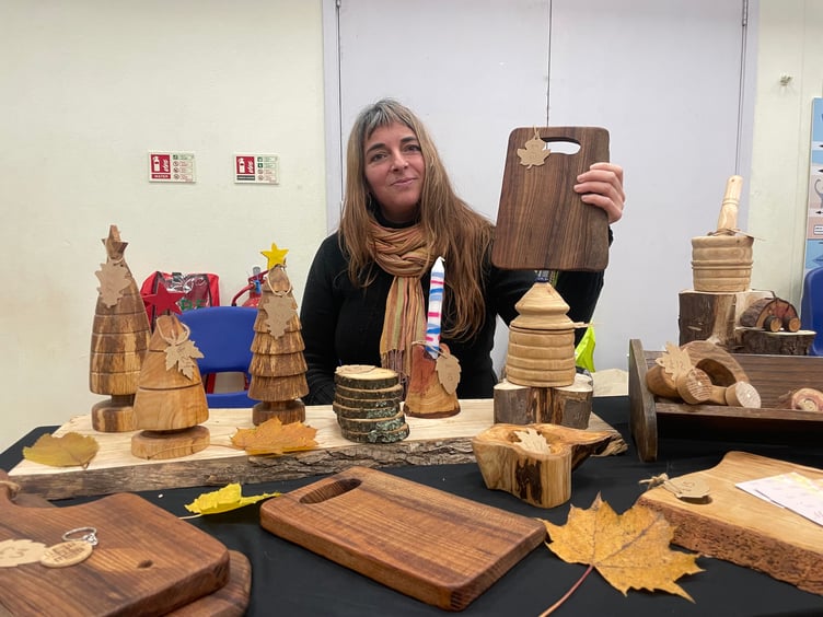 Clara San Miguel with some of her lathe work.