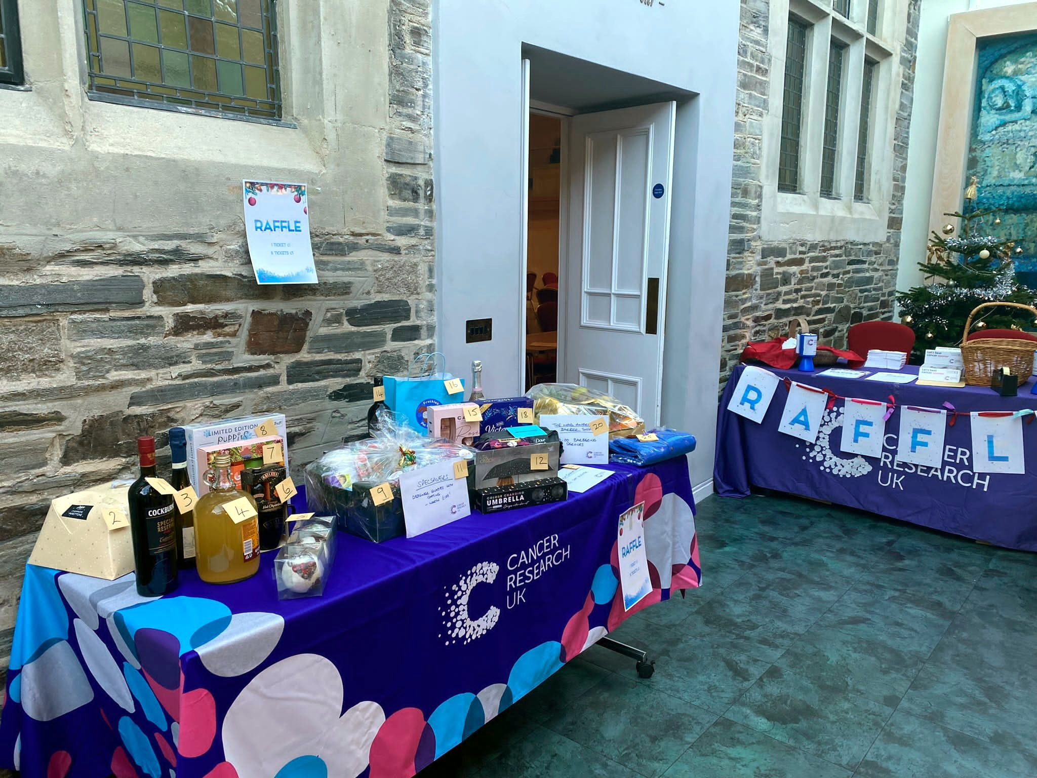 Above: The raffle prizes up for grabs; Below, members of the Launceston Cancer Research committee
