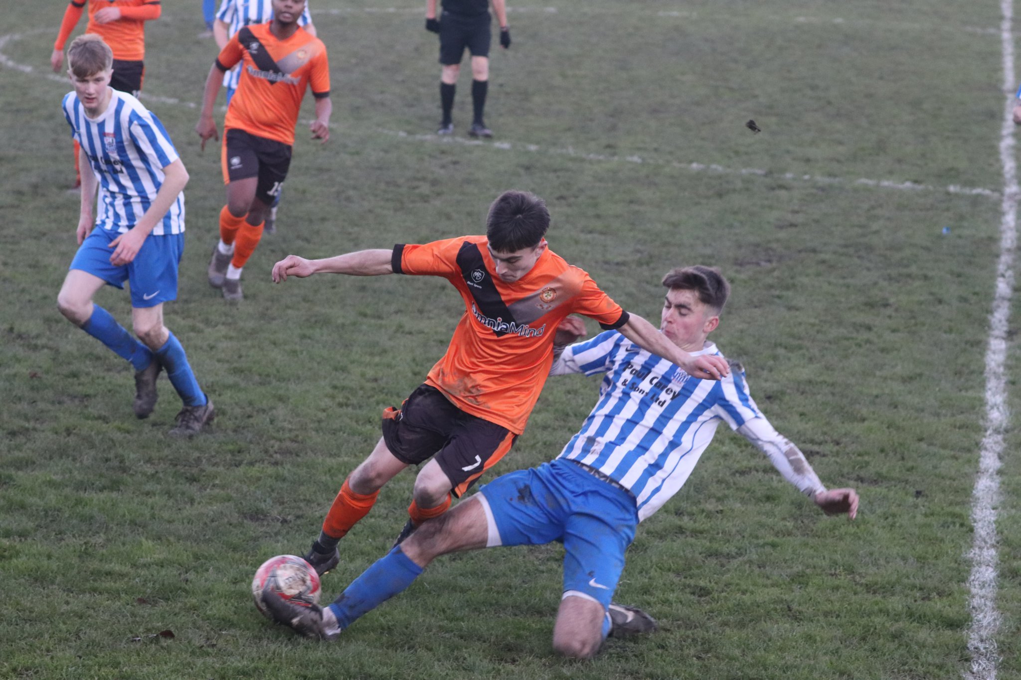 Ramsey’s Dylan Pickles slide tackles Ayre United’s Cameron Torr during Saturday’s northern derby clash at Ballacloan Stadium. Pickles helped the home side win the Canada Life Premier League contest 1-0 (Photo: Paul Hatton)