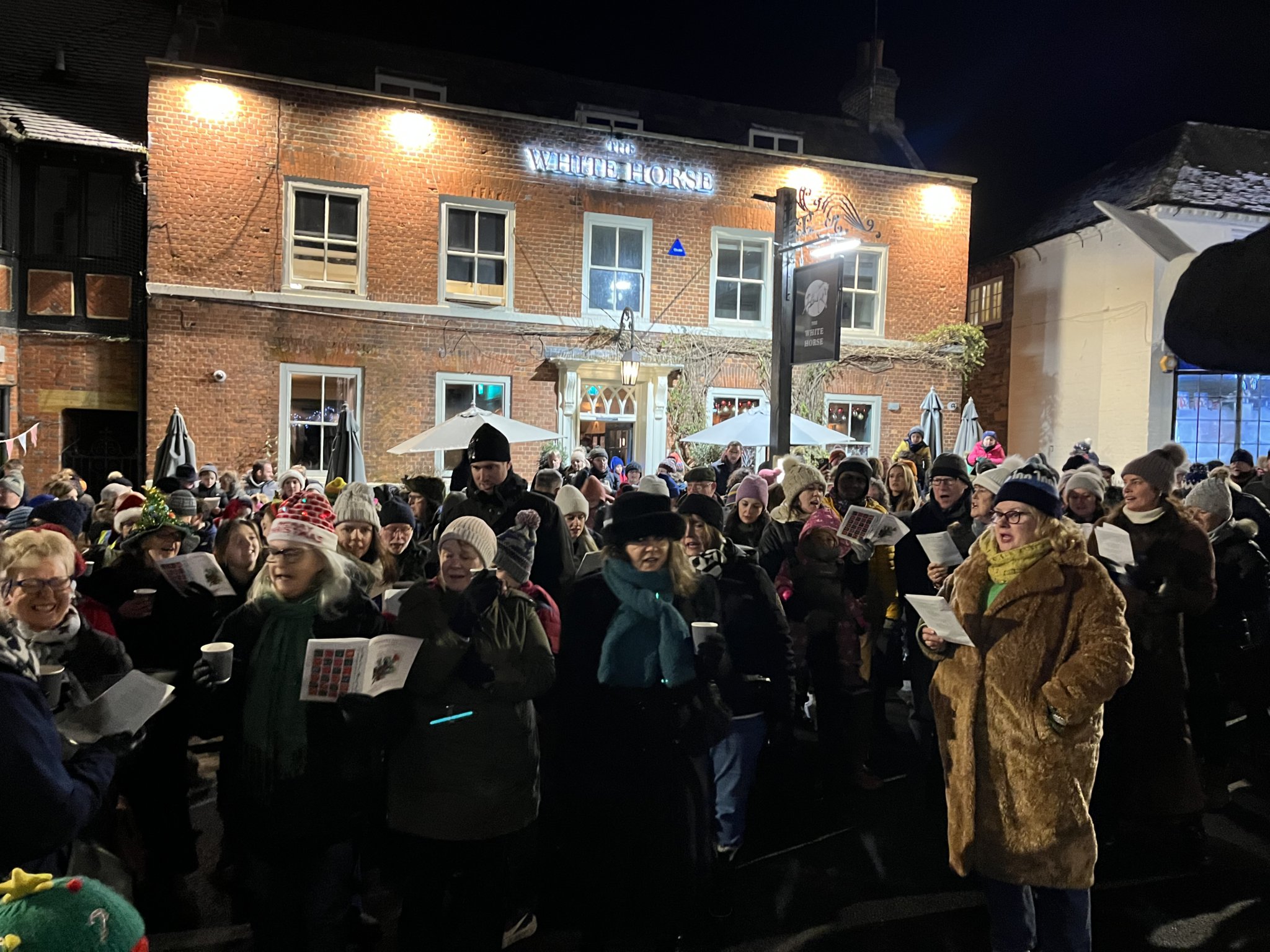 Putting their best voice forward: Several hundred people attended the carols around the Christmas tree event in Haslemere High Street