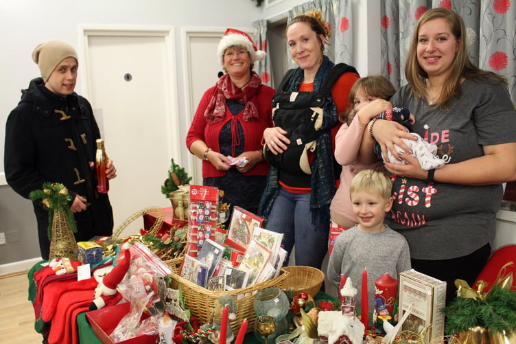 Selling all sorts of Christmas goodies from a house clearance, a six week-old baby with the ladies. SR 6484